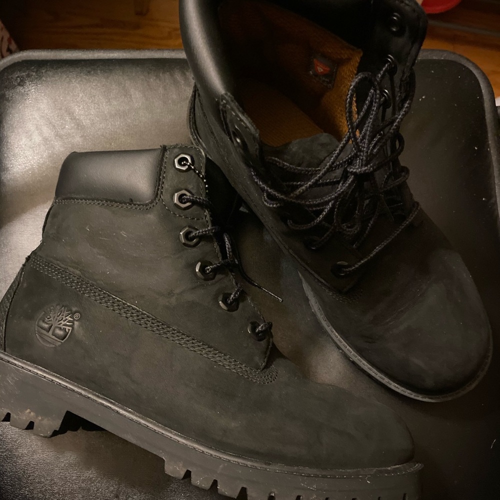 Black Timberland boots.